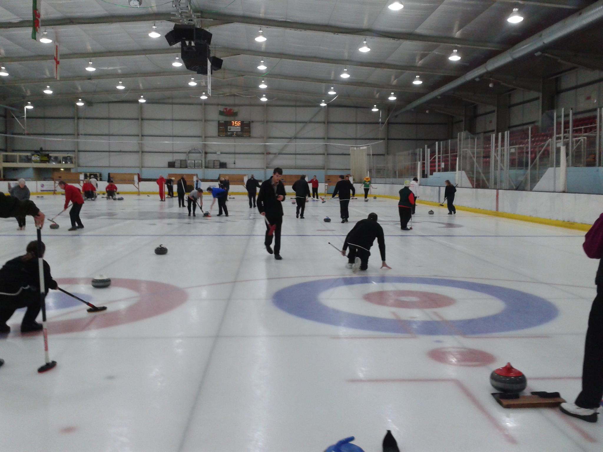 Photograph of Deeside ice rink, with four games being played