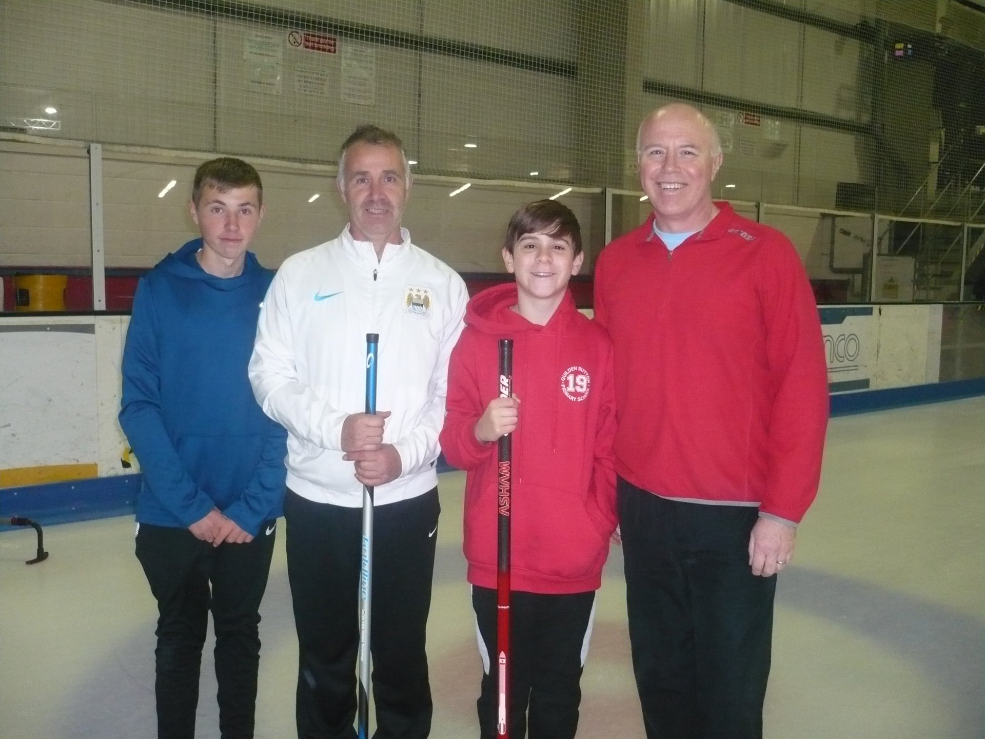 Photograph of Team Tanner, two fathers with their two teenage sons