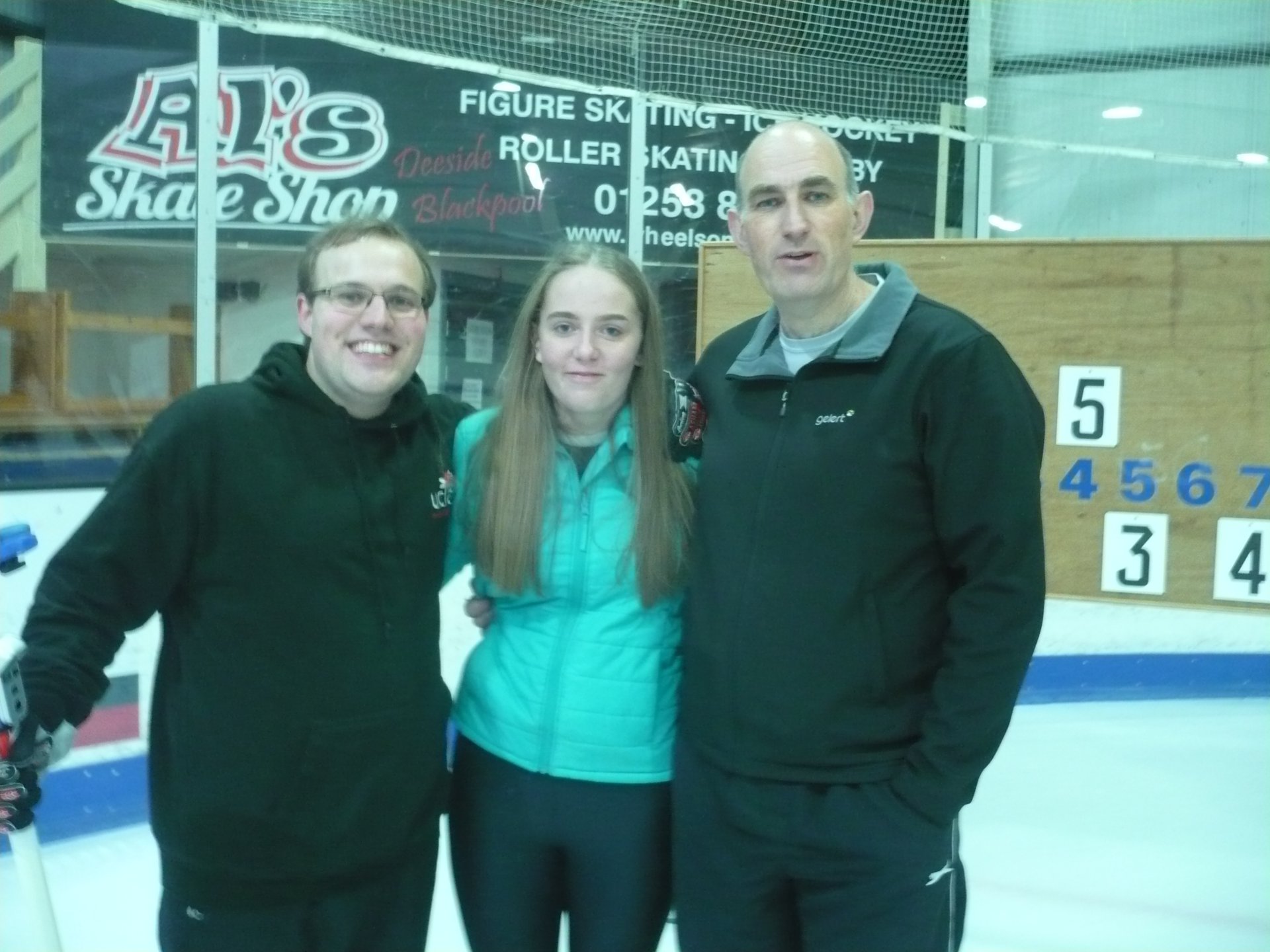 Family photograph of a white father with his son and daughter